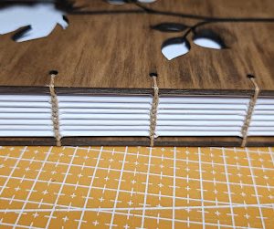 20250602_005548 Handmade Wooden Notebook with Coptic Stitch Binding